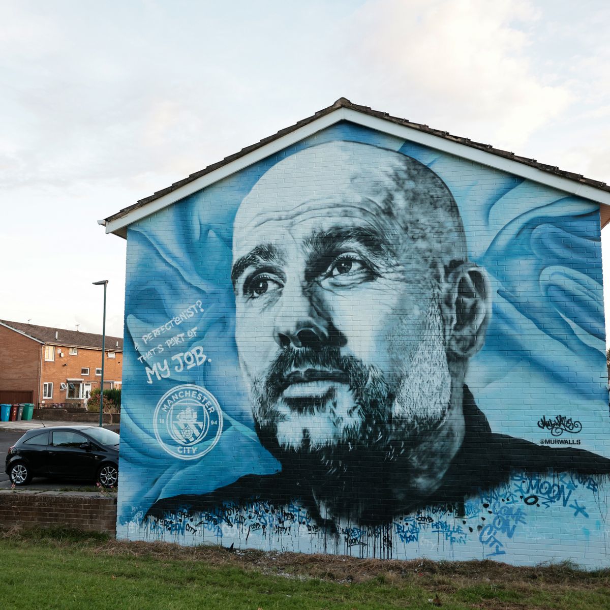 Pep Guardiola mural defaced with 'MUFC' graffiti near the Etihad is cleaned up - Manchester Evening News